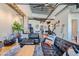 Open concept living room with hardwood floors, exposed beams, and modern furniture at 2020 Arapahoe St # 950, Denver, CO 80205