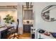Stylish wet bar with dark gray cabinets and granite countertop at 2020 Arapahoe St # 950, Denver, CO 80205