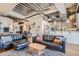 Open living room with exposed beams, modern furniture, and stylish decor at 2020 Arapahoe St # 950, Denver, CO 80205
