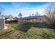 Spacious fenced backyard with storage shed and covered patio at 3379 S Flamingo Way, Denver, CO 80222