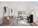 Bright living room with bay windows and neutral decor at 9176 Sugarstone Cir, Highlands Ranch, CO 80130