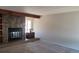 Living room with stone fireplace and built-in shelving at 1485 S Salem Way, Aurora, CO 80012