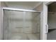 Walk-in shower with glass enclosure and seat at 1485 S Salem Way, Aurora, CO 80012