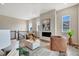 Bright and airy living room with a cozy fireplace at 8668 S Quatar St, Aurora, CO 80016