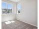 Bright bedroom with neutral carpet and large window at 465 Interlocken Blvd # 101, Broomfield, CO 80021