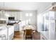 Kitchen dining area with wooden table and sliding glass doors at 998 Larkspur Dr, Erie, CO 80516