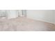 Bright bedroom featuring neutral wall and carpet at 3322 N Highlands Creek Pkwy, Aurora, CO 80019