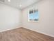 Small office with wood-look flooring and window view at 3322 N Highlands Creek Pkwy, Aurora, CO 80019