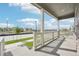 Covered front porch with white railing and view of the neighborhood at 3322 N Highlands Creek Pkwy, Aurora, CO 80019