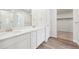 Bathroom boasting double sinks and access to a closet at 3322 N Highlands Creek Pkwy, Aurora, CO 80019
