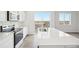 Modern kitchen with stainless steel appliances and deck access at 3322 N Highlands Creek Pkwy, Aurora, CO 80019