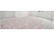 Carpeted bedroom with neutral walls at 3322 N Highlands Creek Pkwy, Aurora, CO 80019