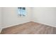 Bright and spacious office with wood-look flooring and a window at 3322 N Highlands Creek Pkwy, Aurora, CO 80019