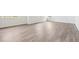 Spacious living room with light gray vinyl plank flooring at 3322 N Highlands Creek Pkwy, Aurora, CO 80019