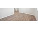 Simple office with wood-look flooring and view to staircase at 3322 N Highlands Creek Pkwy, Aurora, CO 80019