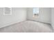 Well-lit bedroom with carpet and window at 3322 N Highlands Creek Pkwy, Aurora, CO 80019