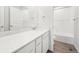 Bathroom with a vanity, tub, and white tile at 3322 N Highlands Creek Pkwy, Aurora, CO 80019