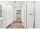 Modern bathroom with double vanity and a walk-in shower at 3322 N Highlands Creek Pkwy, Aurora, CO 80019