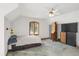 Carpeted bedroom with a ceiling fan, a large window, and storage furniture at 3619 Estates Cir, Larkspur, CO 80118