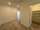 Bright hallway with carpet flooring and a large pantry at 14584 W 91St Dr # D, Arvada, CO 80005