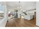 Spacious dining area with hardwood floors, sliding glass doors, and chandelier at 39650 Congress Ln, Elizabeth, CO 80107