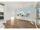 Bright dining area with hardwood floors and large windows offering scenic views at 39650 Congress Ln, Elizabeth, CO 80107