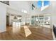 Bright living room with hardwood floors, fireplace, and sliding glass doors at 39650 Congress Ln, Elizabeth, CO 80107