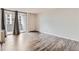 Bedroom with hardwood floors and access to a private balcony at 909 N Logan St # 4A, Denver, CO 80203