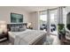 Main bedroom with private balcony access at 909 N Logan St # 4A, Denver, CO 80203
