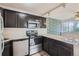 Well-equipped kitchen with stainless steel appliances and granite countertops at 909 N Logan St # 4A, Denver, CO 80203