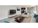 Bright living room features hardwood floors and an open concept layout at 909 N Logan St # 4A, Denver, CO 80203