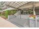Building entrance with a covered walkway and landscaped planters at 909 N Logan St # 4A, Denver, CO 80203