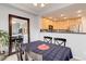 Dining area with kitchen pass-through and view of the living room at 23070 York Ave, Parker, CO 80138