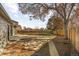 Large backyard with wooden fence and patio at 11044 Forest Way, Thornton, CO 80233