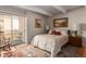 Cozy bedroom with balcony access and ample natural light at 8060 E Girard Ave # 719, Denver, CO 80231