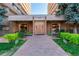 Building entrance with landscaping and benches at 8060 E Girard Ave # 719, Denver, CO 80231
