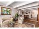 Spacious living room with hardwood floors and a view into the dining area at 8060 E Girard Ave # 719, Denver, CO 80231