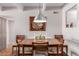 Bright dining room with wood table and chairs, ready for gatherings at 8060 E Girard Ave # 719, Denver, CO 80231