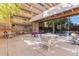 Community patio area with tables, chairs, and a swimming pool at 8060 E Girard Ave # 719, Denver, CO 80231