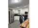 Updated kitchen with stainless steel appliances and wood countertop at 4899 S Dudley St # 1E, Littleton, CO 80123