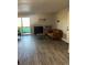 Living room with fireplace and sliding door to balcony at 4899 S Dudley St # 1E, Littleton, CO 80123