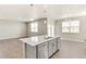 Modern kitchen with island and stainless steel dishwasher at 18067 Dandy Brush Ln, Parker, CO 80134