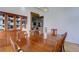 Spacious dining area with a wood table, cabinetry, and views into the kitchen at 1901 S Newport, Denver, CO 80224