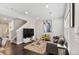 Bright and airy living room with dark hardwood floors and modern furnishings at 11255 E 25Th Ave, Aurora, CO 80010
