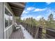 Deck with mountain views and seating area at 30162 Pine Crest Dr, Evergreen, CO 80439