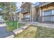 Tan condo building with stairs and balcony at 1777 S Pitkin St # B, Aurora, CO 80017