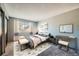 Bedroom with bed, dresser, and window at 1777 S Pitkin St # B, Aurora, CO 80017
