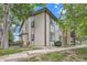 Tan two-story building with stone accents and landscaping at 1777 S Pitkin St # B, Aurora, CO 80017