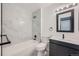 Clean bathroom with a bathtub, toilet and modern vanity at 1777 S Pitkin St # B, Aurora, CO 80017