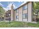 Tan two-story building with stone accents and landscaping at 1777 S Pitkin St # B, Aurora, CO 80017